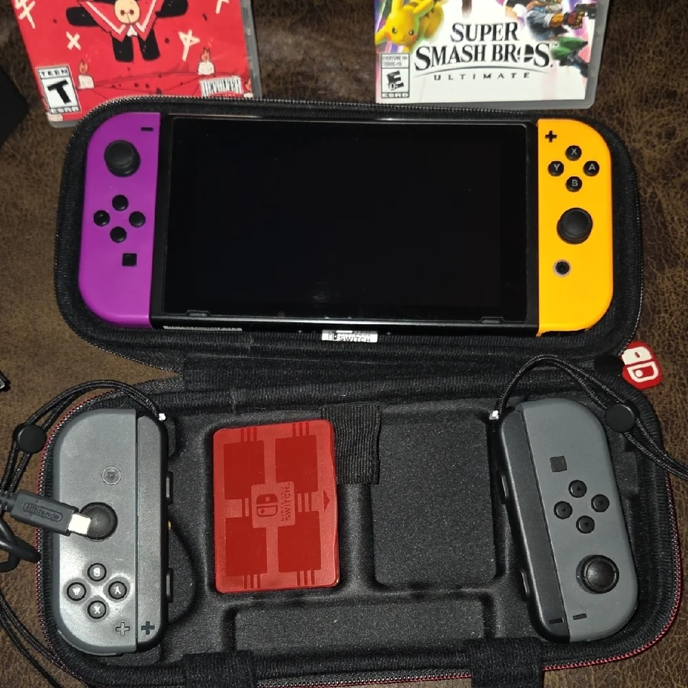 Nintendo Switch Console with Purple and Orange Joy-Con